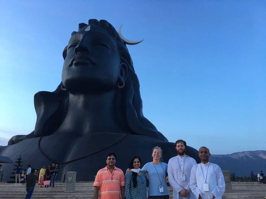 Amit with fellow seekers at the Adiyogi Shiva statue during a pilgrimage in India